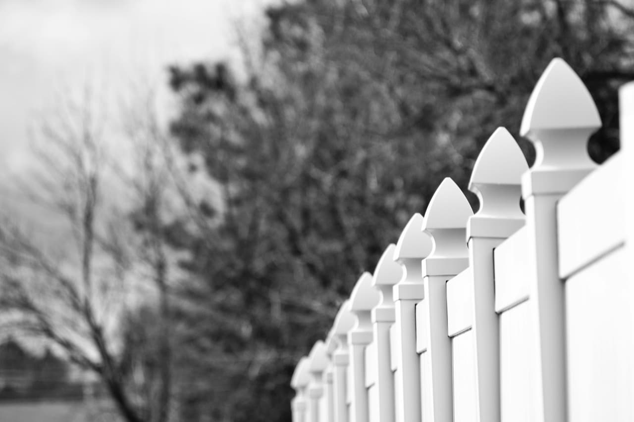 White-painted wood fence in a residential Union County yard